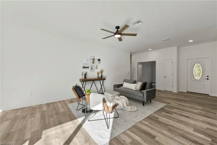 Living room with ceiling fan.