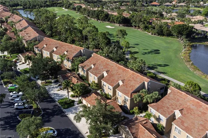 Aerial perspective highlighting numerous residential structures with terracotta-style roof tiles