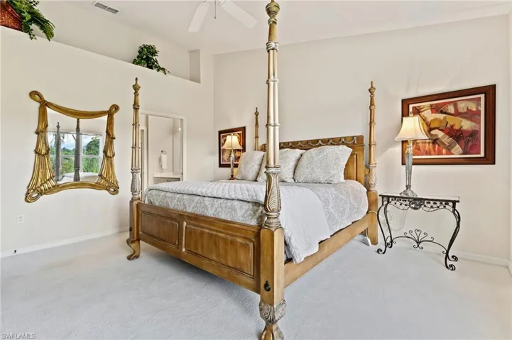 High ceilings featuring an upper decorative ledge