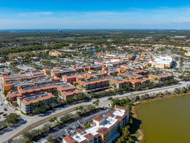 Aerial view of property's location with a nearby body of water