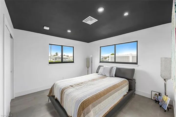 Bedroom with multiple windows