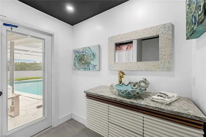Doorway to outside with tile floors