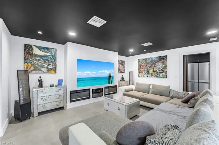 Living room featuring light tile floors