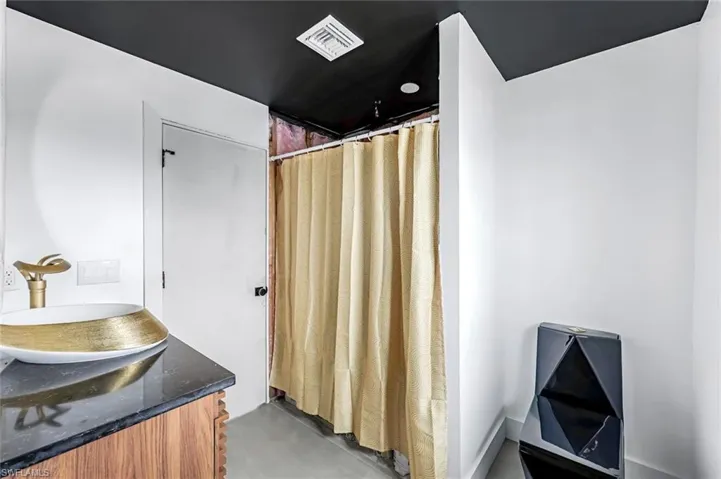 Bathroom featuring 24x48 porcelain tile floors