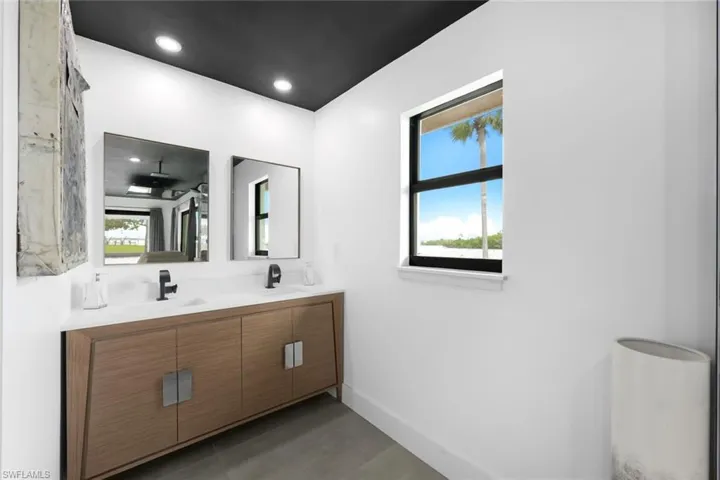Bathroom with dual vanity and plenty of natural light