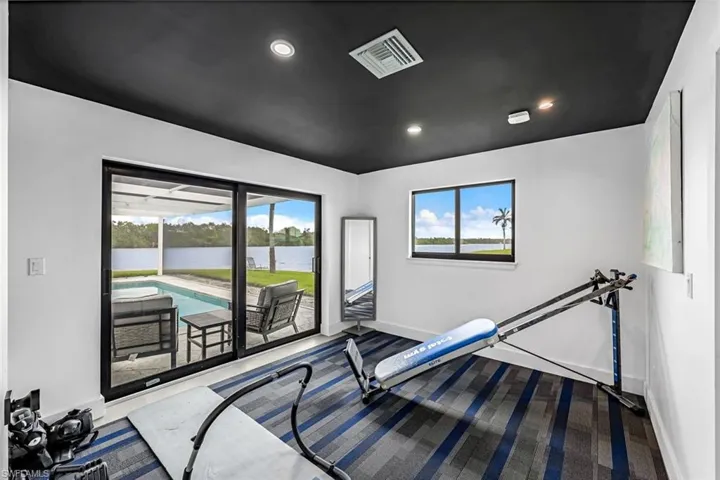 Bedroom used as a Workout room with a wealth of natural light.