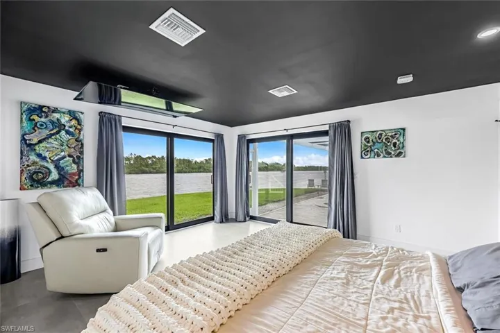 Tiled bedroom featuring access to exterior