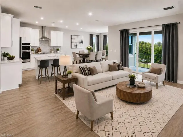 Photo includes reality staging to showcase the possibility of the kitchen/living/dining room. Design services included with purchase!