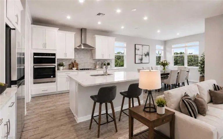 Photo includes reality staging to showcase the possibility of the kitchen/dining/living room. Design services included with purchase!