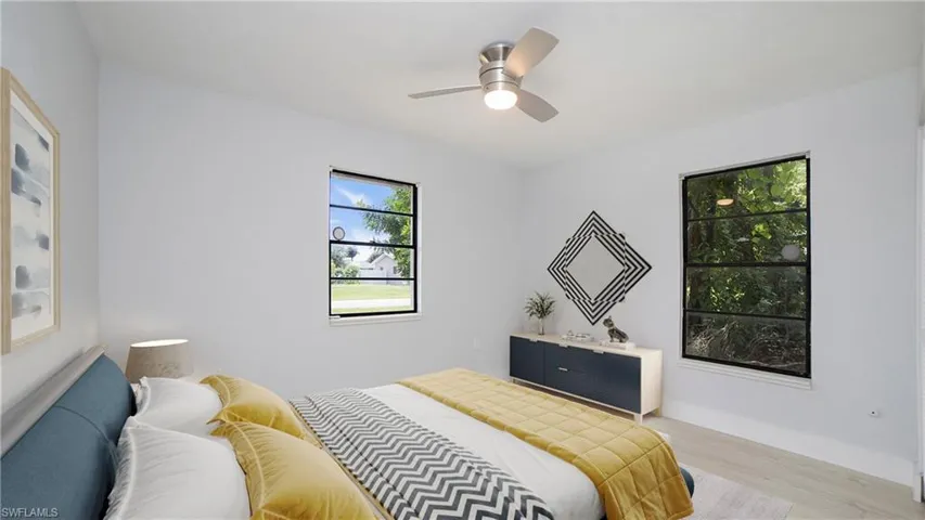 Bedroom featuring ceiling fan and light hardwood / wood-style floors