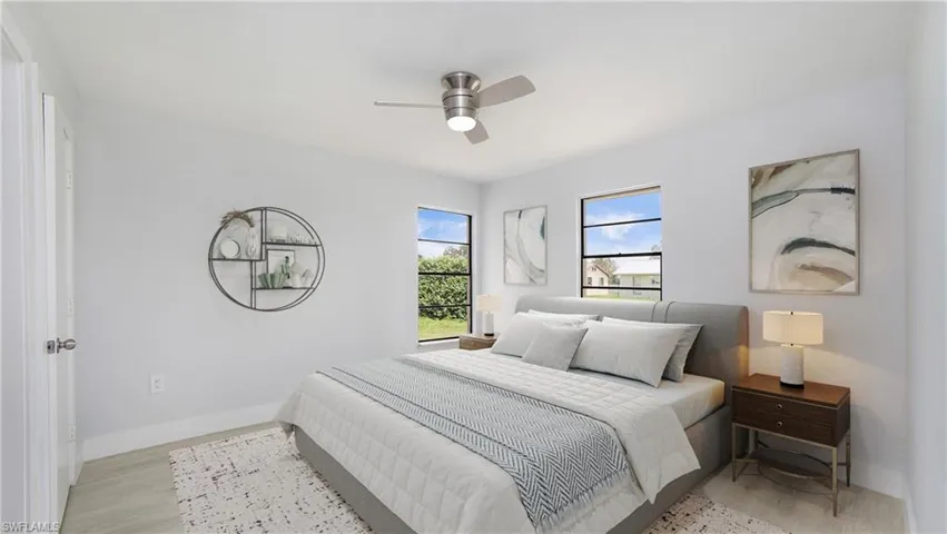 Bedroom #2 with ceiling fan and light wood-type flooring