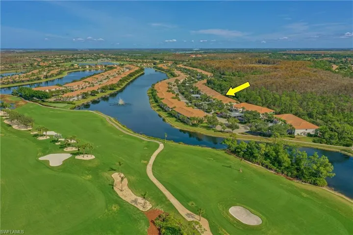 Drone / aerial view of a golf club and a large body of water