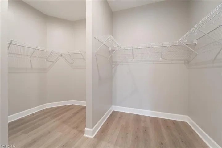 Walk in closet featuring light hardwood / wood-style flooring