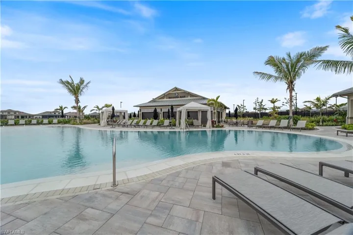 View of swimming pool with a gazebo, a water view, and a patio