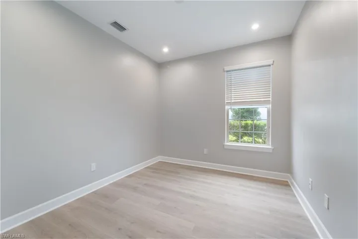 Unfurnished room with light hardwood / wood-style floors