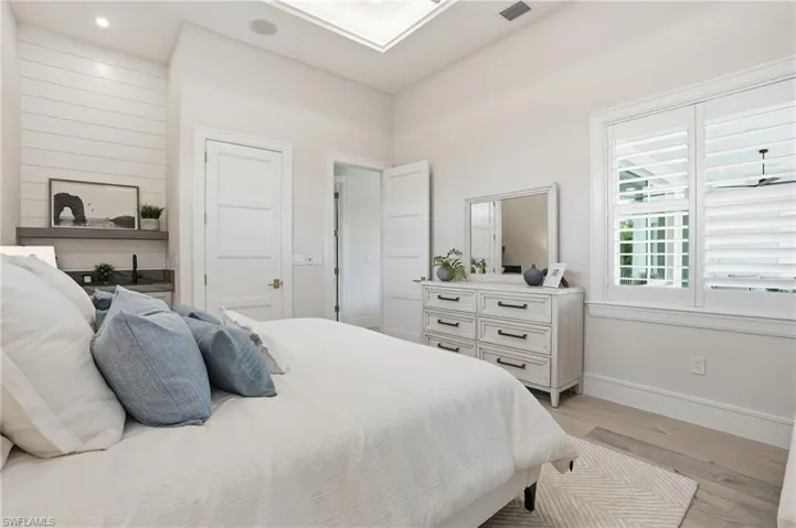 Bedroom featuring baseboards and light wood-style floors