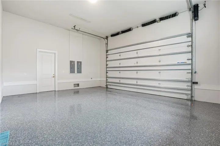 Garage featuring electric panel