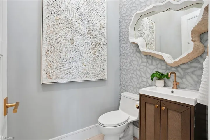 Half bath with vanity and toilet