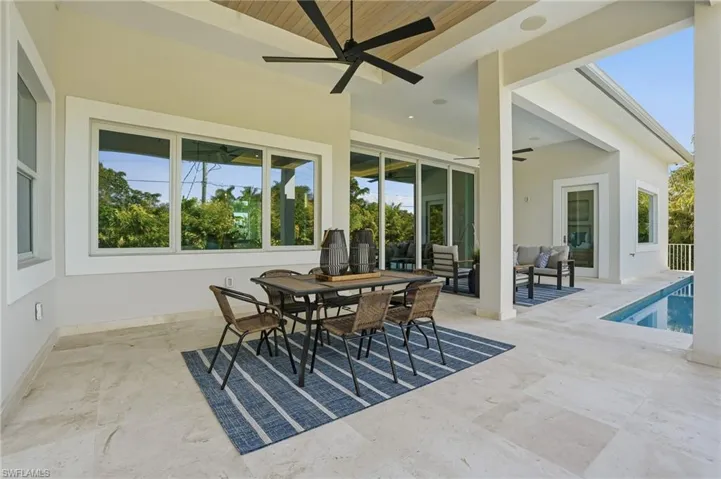 Sunroom / solarium featuring wood ceiling