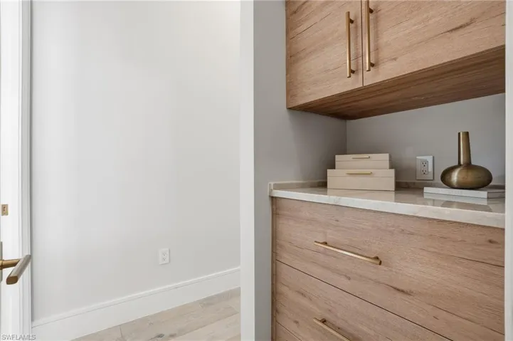 Detailed view of baseboards and wood finished floors