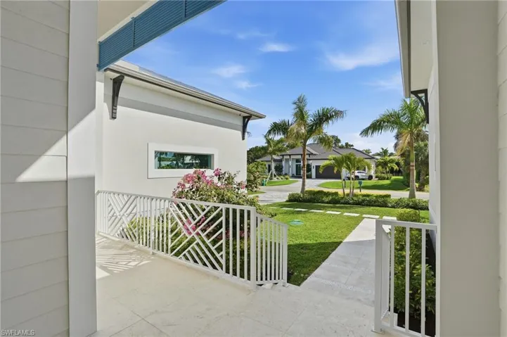 Covered porch with a yard