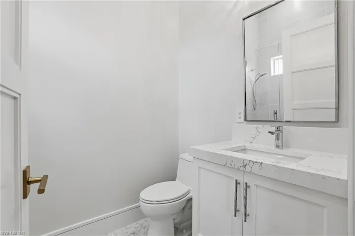 Bathroom with vanity and a shower