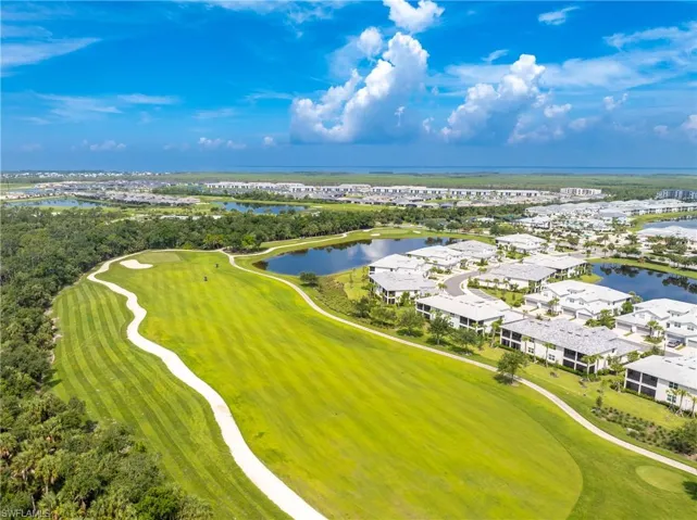 Drone / aerial view with view of golf course and a water view