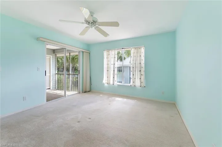 Primary bedroom room featuring ceiling fan and carpet