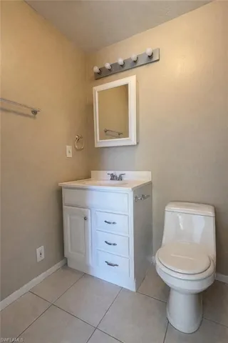 Bathroom with vanity and light tile patterned floors