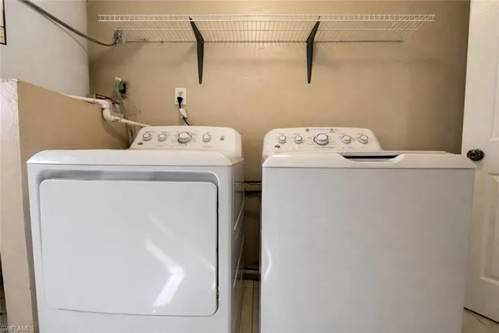 Laundry room featuring washing machine and clothes dryer