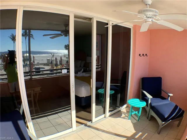 Balcony opens to beachfront ,and pool