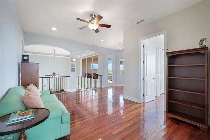 Upstairs, spacious den/flex space with beautiful Brazilian Koa wood flooring