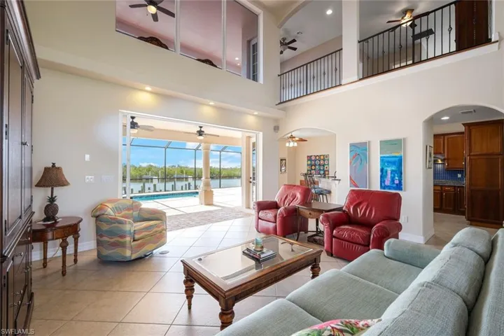 Spacious great room, open to the 2nd level and lanai/pool area
