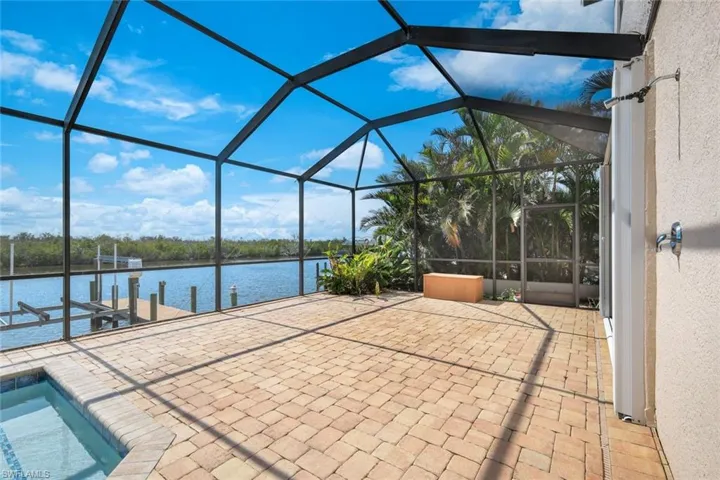 Spacious, screened paver area with space for lots of patio furniture and also outdoor shower