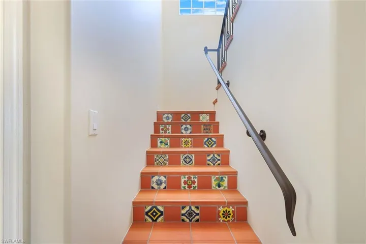 Stairway to 2nd level with decorative hand painted talavera tiles
