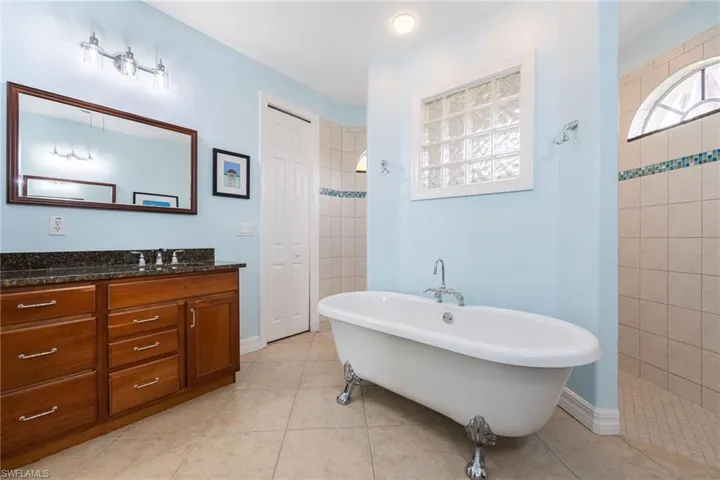 Primary bathroom with tub and shower