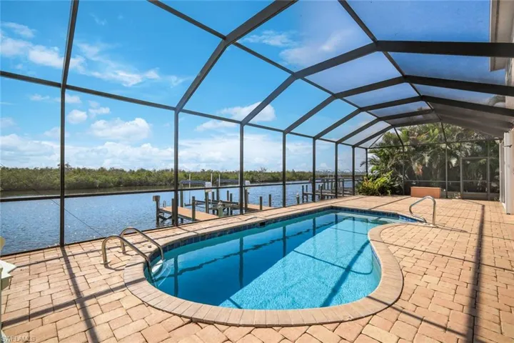 Sparkling pool view toward dock and wide North spreader canal