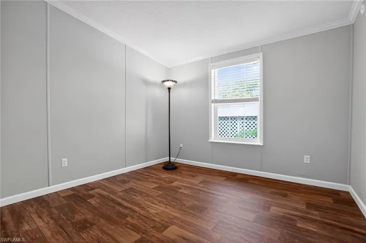 2nd Bedroom with a wood-style flooring, and crown molding