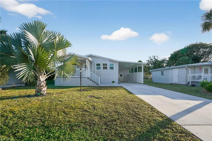 WELCOME HOME! Enjoy the large front yard w/ an attached carport