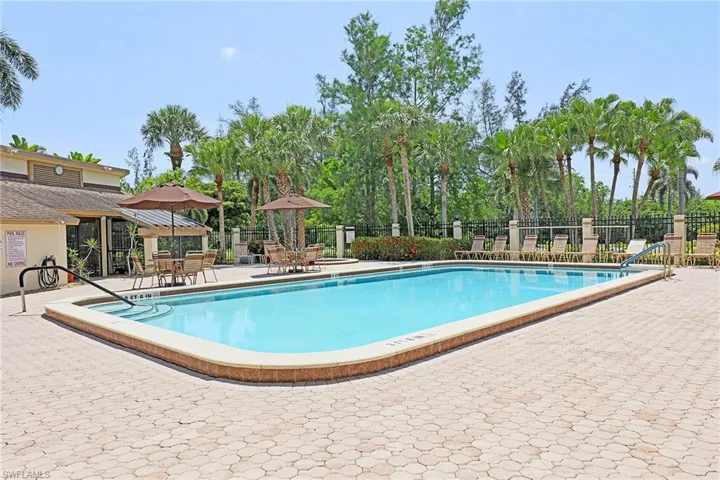 Community pool with a patio area