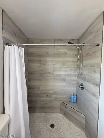 Full bath with tiled shower