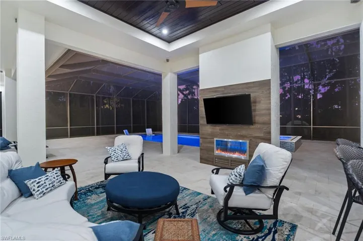 Phenomenal seating area with fireplace, and expansive pool deck—perfect for entertaining and al fresco dining.