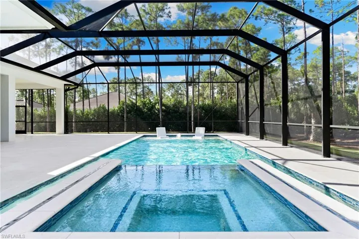 resort-style 38 ft long salt water pool with spa