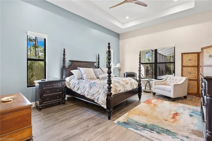 Stunning primary bedroom with a generous walk-in closet with center storage island