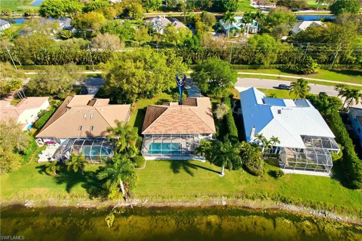 Aerial perspective of suburban area with a large body of water