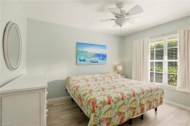 Bedroom featuring light wood finished floors and a ceiling fan
