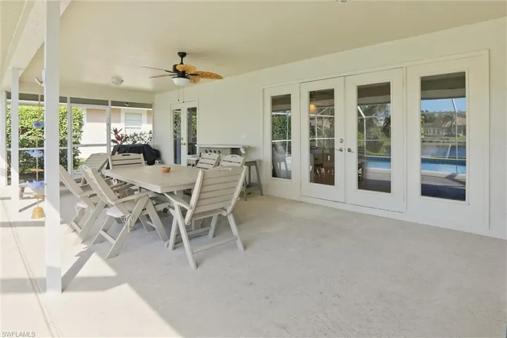 View of patio / terrace featuring french doors, a ceiling fan, and outdoor dining space