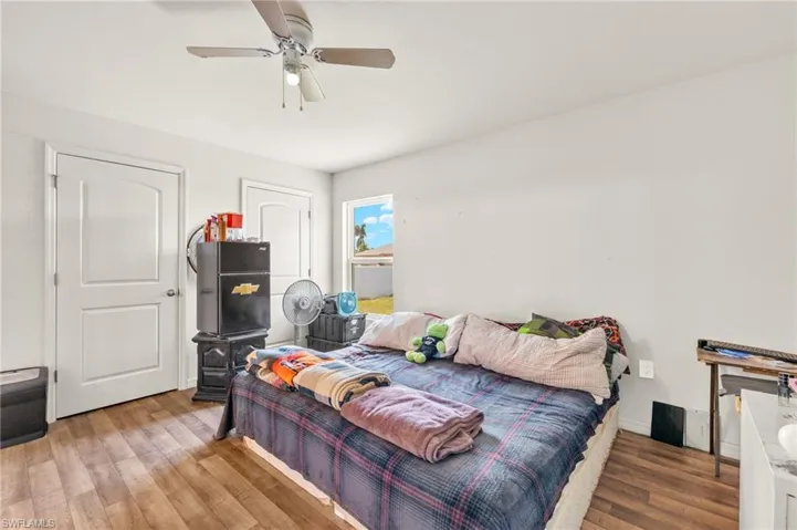 Bedroom featuring wood finished floors and ceiling fan