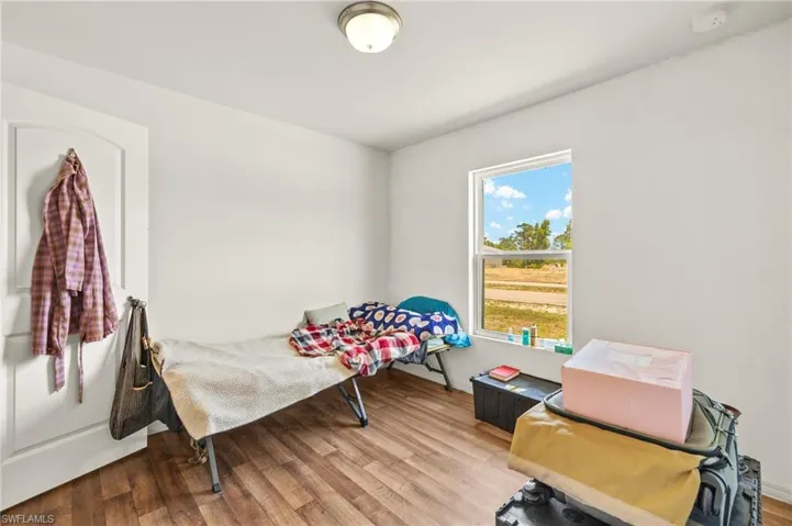 Bedroom featuring wood finished floors