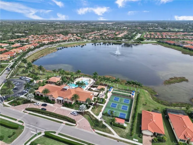 Aerial overview of property's location with nearby suburban area and a nearby body of water